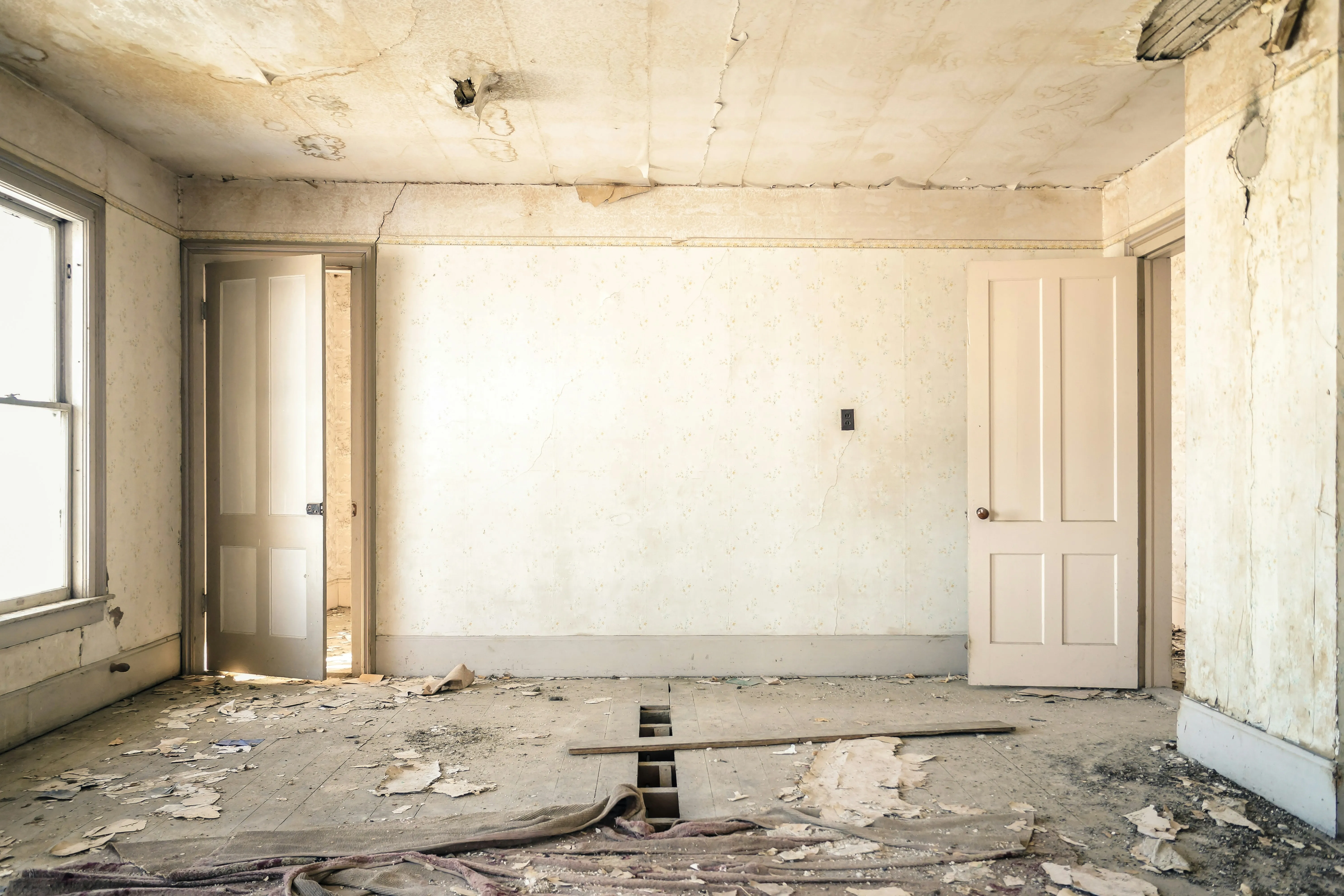 Derelict living room before renovation